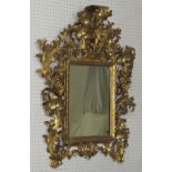 19th century rectangular wall mirror with an extravagantly carved gilt wood acanthus frame with