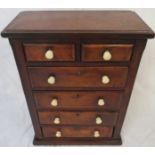 Mahogany apprentice chest of two short over four long drawers, the drawers with white plastic knop