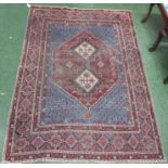 Persian antique Shiraz rug with blue ground and boteh decoration around a central diamond
