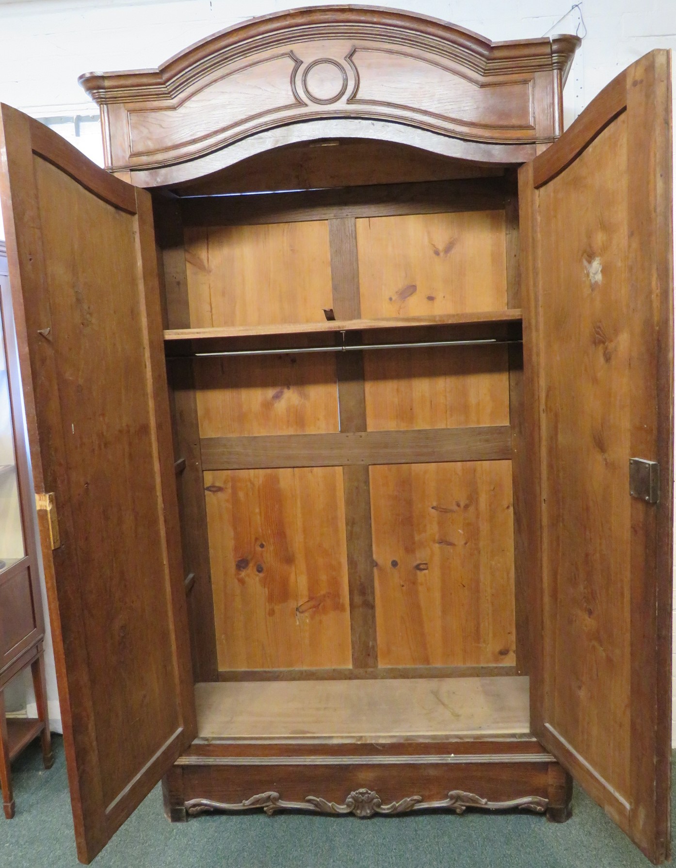An early 19th century tall French oak armoire, two arch topped doors with long tooled brass - Image 2 of 7
