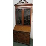 Sheraton revival inlaid and banded mahogany bureau bookcase, the bookcase with two doors with