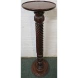 Mahogany plant stand with a spiral reeded column, carved with foliage towards the stepped circular