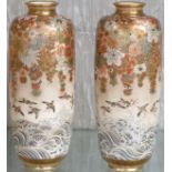 Pair of Satsuma pottery vases, tapering cylindrical form, richly enamelled with bunches of flowers