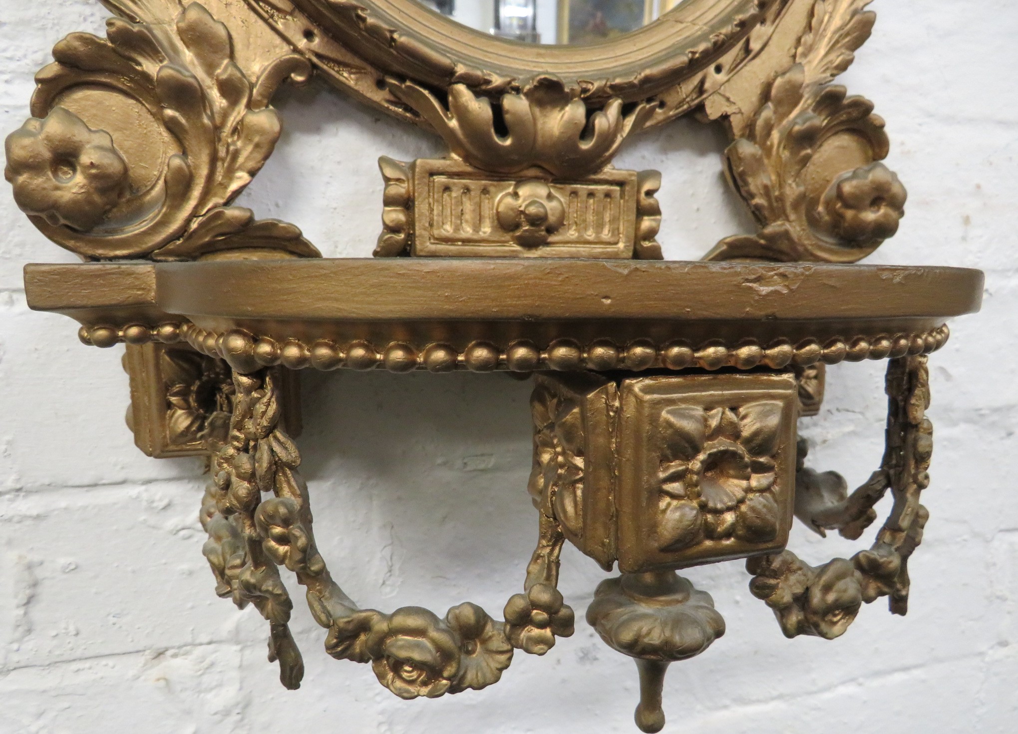 Gilt wood wall bracket with oval mirror and a shelf above and below, carved acanthus and swags and a - Image 3 of 3