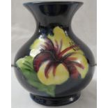 Moorcroft Pottery small baluster vase with flared neck, blue ground with tubelined decoration of red