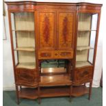 An Edwardian Maple & Co large inlaid mahogany china display cabinet, a glazed serpentine door