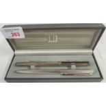 Dunhill Germany silver plated engine turned fountain pen, nib marked 14K 585, and a similarly styled