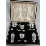 Cased Adie Brothers six-part silver condiment set, (two mustards, two salts, and two peppers with