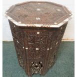 Indian octagonal side table, finely carved and with inscriptions, inlaid with bone and mother of