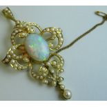 15 carat gold scroll pendant brooch set with an opal and eighty-two seed pearls of graduated