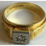 18 carat gold signet ring set with diamond, foliate carving to the shoulders, the brilliant cut