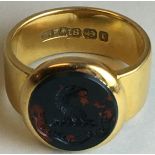 18 carat gold signet ring with oval intaglio seal in red and green stone, eagle's head and motto Nil