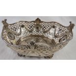 Silver oval pierced bowl with repousse wreaths, blind and foliate oval shields, raised on four