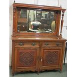 Arts and Crafts style mahogany sideboard with mirrored back, the top with a bevelled shaped oblong