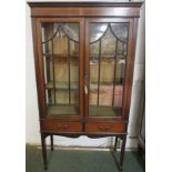 An Edwardian china display cabinet, mahogany with ebony and boxwood stringing, two mullioned doors