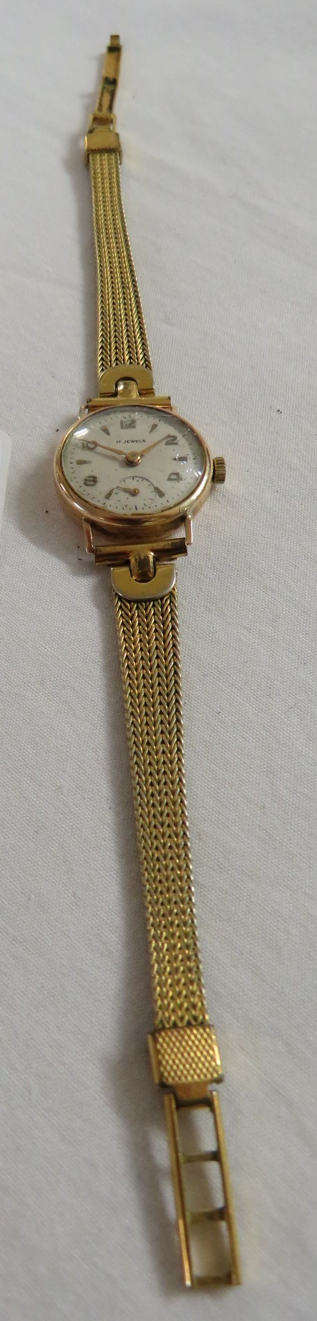 18 carat gold cased ladies mechanical wristwatch, Arabic and baton numerals, subsidiary seconds