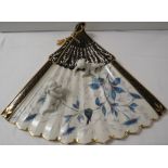 Porcelain wall plaque modelled as a fan with two moulded cherubs, black enamel and gilding and