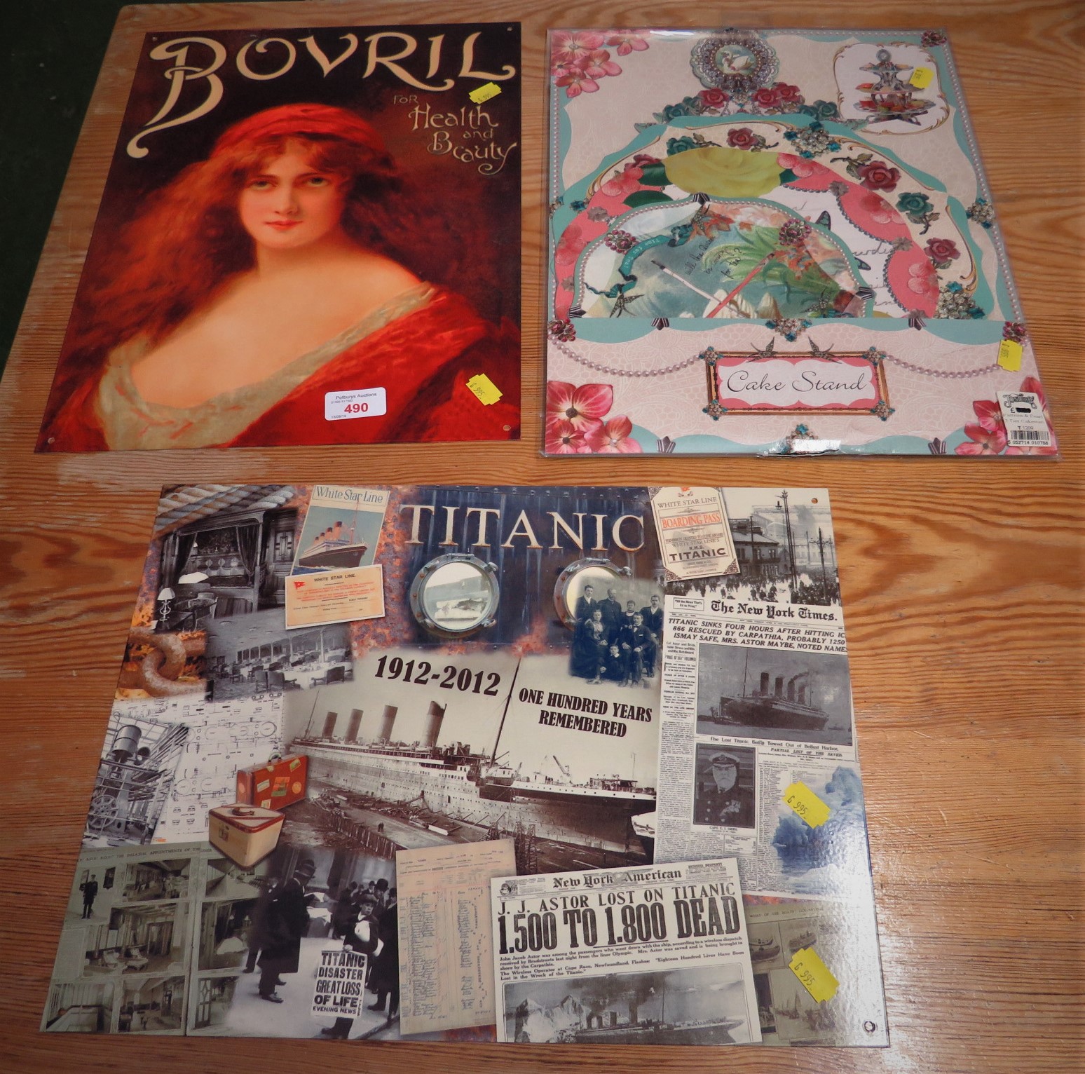 TWO REPRODUCTION TIN SIGNS - BOVRIL AND TITANIC CENTENARY, TOGETHER WITH CARD CAKE STAND