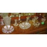 SELECTION OF CUT AND PRESSED GLASS INCLUDING CANDLESTICKS, CRANBERRY GLASS SUGAR CASTER AND LIDDED