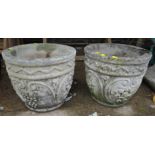 PAIR OF COMPOSITE STONE GARDEN POTS DECORATED WITH BUNCHES OF GRAPES