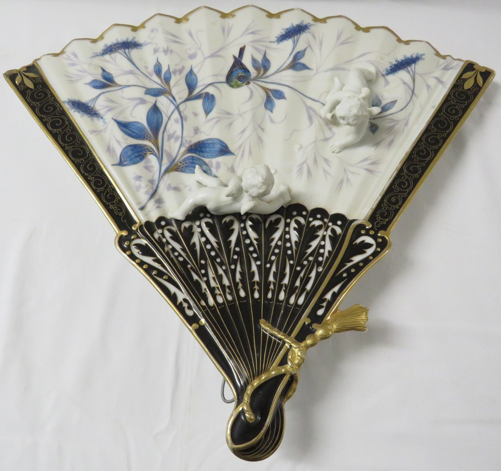 Porcelain wall plaque modelled as a fan with two moulded cherubs, black enamel and gilding and - Image 5 of 6