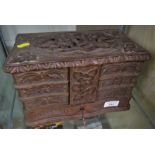 BLACK FOREST STYLE CARVED WOODEN JEWELLERY BOX WITH LIFT TOP AND SIX FOLD OUT TRAYS, TOGETHER WITH