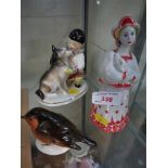 CERAMIC FIGURE OF WOMAN IN RUSSIAN DRESS AND TWO OTHER USSR FIGURES - BOY WITH DOG AND ROBIN