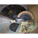 BLACK SILK FAN DECORATED WITH SEQUINS AND THREE OTHER DECORATIVE FANS