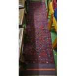 HAND KNOTTED BLUE GROUND FLOOR RUNNER WITH FIVE CENTRAL MEDALLIONS, 255CM X 65CM