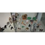 SELECTION OF CERAMIC AND OTHER FIGURINES OF ANIMALS TOGETHER WITH TWO FIGURES OF CHILDREN