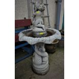 COMPOSITE STONE THREE PART BIRDBATH WITH ORIENTAL STYLE CARP DESIGN AND PUTTI, STAMPED 'HENRI