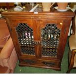 FAR EASTERN STYLE HARDWOOD TELEVISION OR AUDIO CABINET WITH METAL GRILLE DOUBLE DOORS AND SINGLE