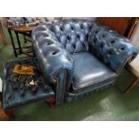 LOW BACKED CHESTERFIELD STYLE ARMCHAIR AND MATCHING FOOTSTOOL IN BLUE FAUX LEATHER