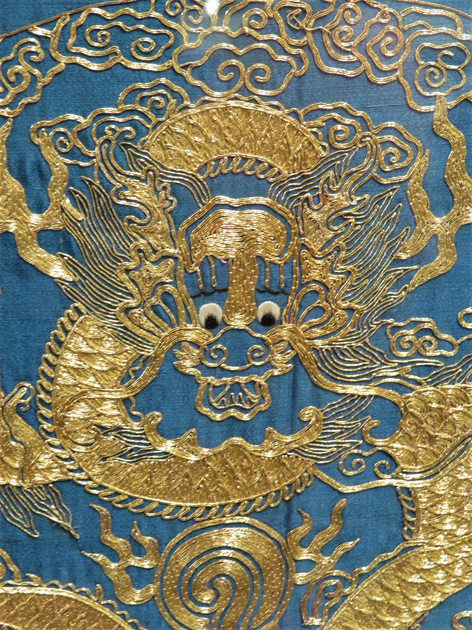 FRAMED AND GLAZED EMBROIDERY IN GOLD COLOURED THREAD DEPICTING CHINESE DRAGON WITH STYLIZED CLOUDS - Image 4 of 8