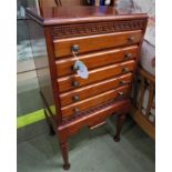 MAHOGANY MUSIC CABINET OF FIVE FALL FRONT DRAWERS, KEY FRET FRIEZE AND STANDING ON TAPERING