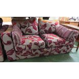 DFS TWO SEATER SOFA IN GREY AND PURPLE FOLIATE PATTERN UPHOLSTERY AND COLOURED ACCENTS (WIDTH