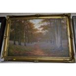 OIL ON CANVAS OF WOMAN GATHERING IN BLUEBELL WOOD, SIGNED PETER DUFFIELD AND IN A DECORATIVE GILT