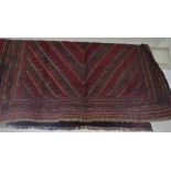 RED GROUND HAND KNOTTED FLOOR RUG WITH GEOMETRIC PATTERN, APPROXIMATELY 128CM X 114CM