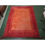 SALMON PINK GROUND WOOLEN RECTANGULAR FLOOR RUG (ABOUT 174CM X 120CM)