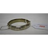 HALF ENGRAVED SILVER BANGLE WITH SAFETY CHAIN, BIRMINGHAM ASSAY, 0.6 OZT