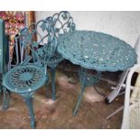 GREEN PAINTED CAST METAL GARDEN TABLE AND TWO CHAIRS (TWO CUSHIONS INSIDE SALEROOM)