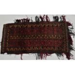 Middle eastern tent bag, red ground with geometric pattern of stylized trees, tasselled, 54cm x
