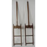 Shop fittings - a pair of hanging brackets for shelves, oak with brass suspension loops, turned