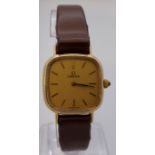 9 carat gold Omega lady's mechanical wristwatch with brown leather strap, oblong champagne dial,