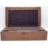 A mahogany writing slope, fitted interior with purple velvet, one inkwell remaining, dimensions