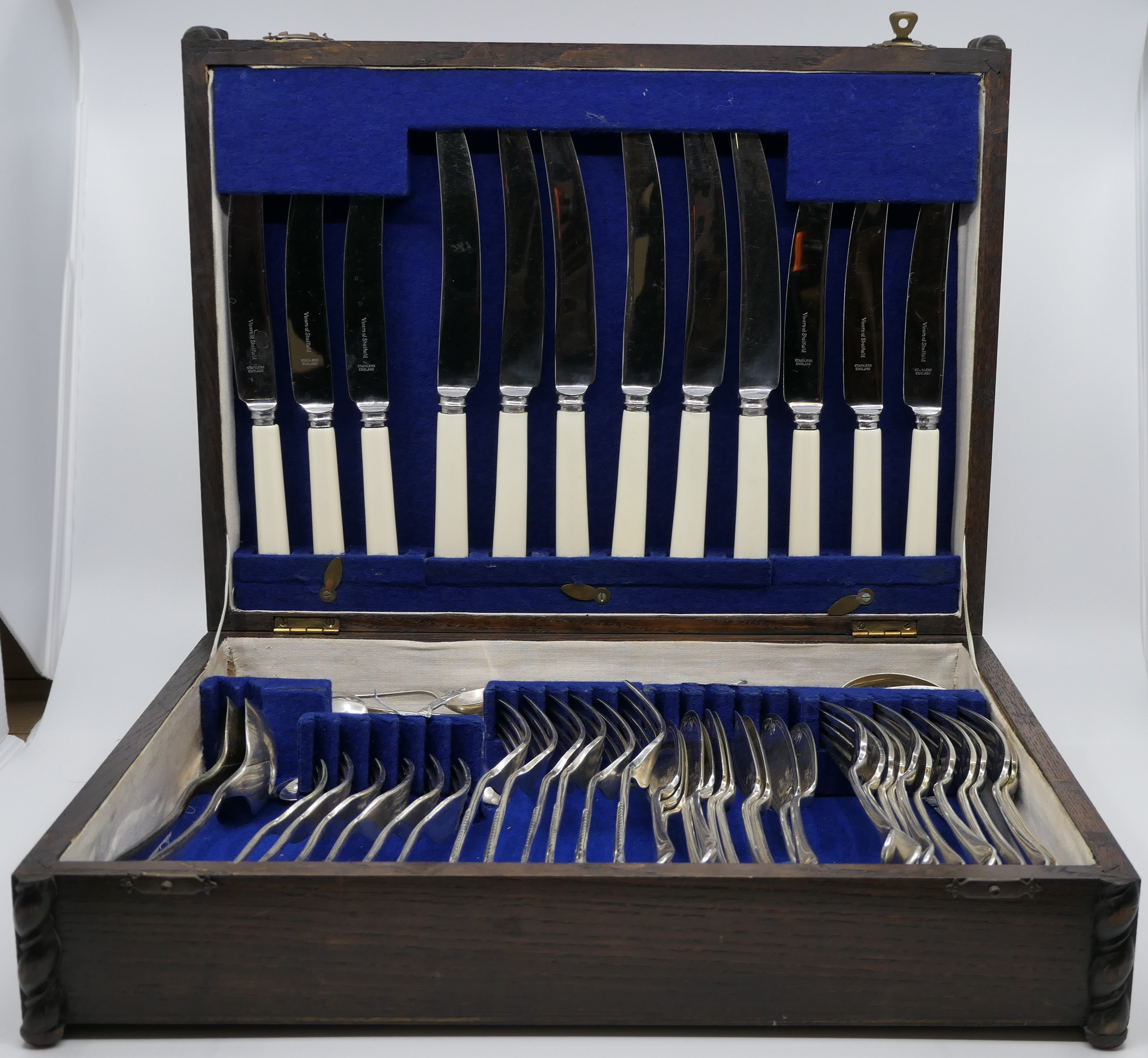 Oak canteen of assorted silver-plated and bone handled cutlery, the canteen with hinged lid and