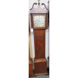 A 30 hour striking mid Victorian long case clock in oak cross banded in mahogany with an ebony and