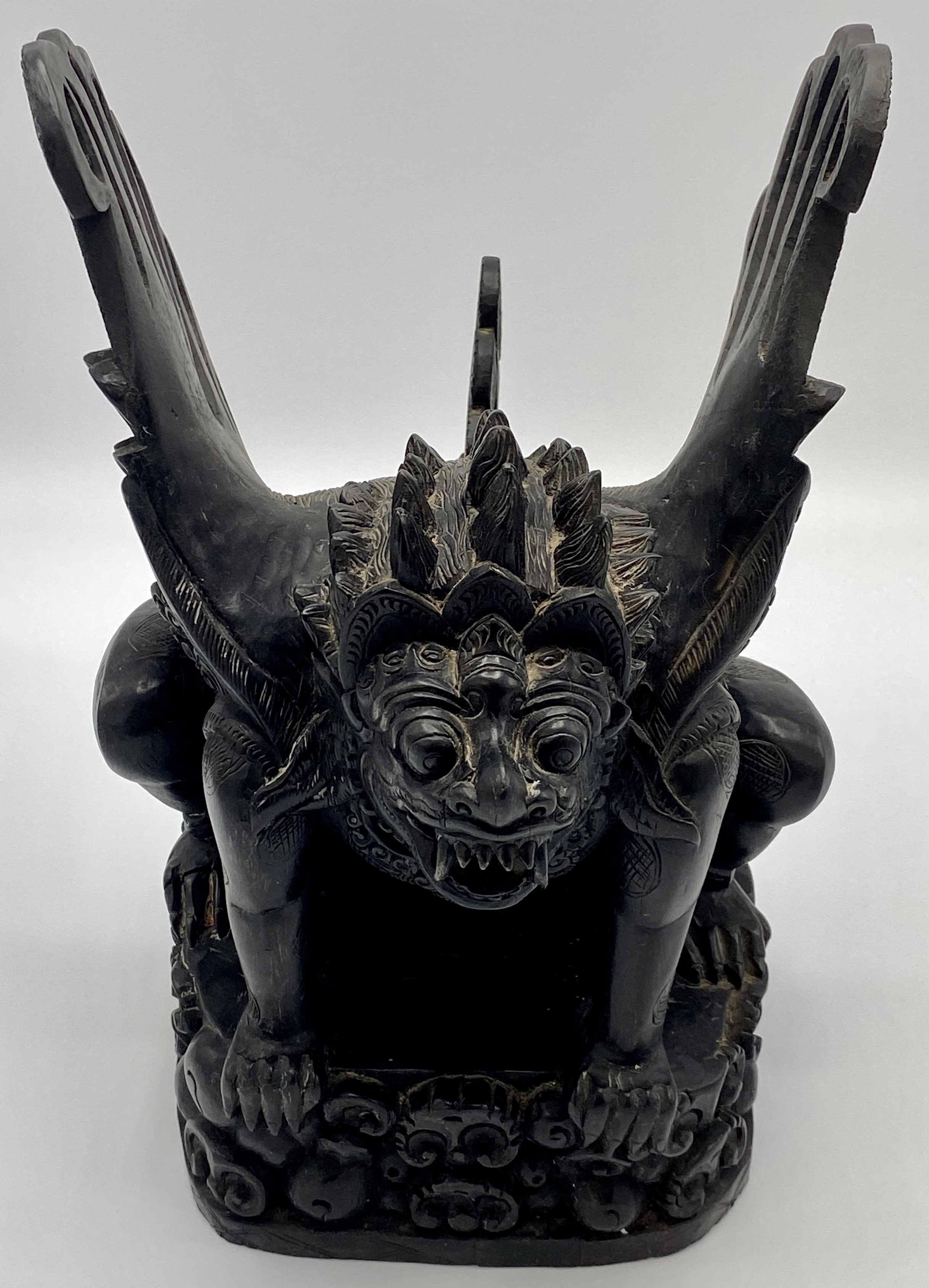 Indonesian carved black stonewood figure of Garuda, height 34.5cm, length 27cm, width 20.5cm