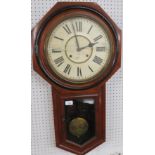 A striking American wall clock by The Ansonia Clock Company New York in a mahogany case with a