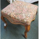 A square low stool with horsehair stuffed seat and pale foliate upholstery, walnut frame with wavy